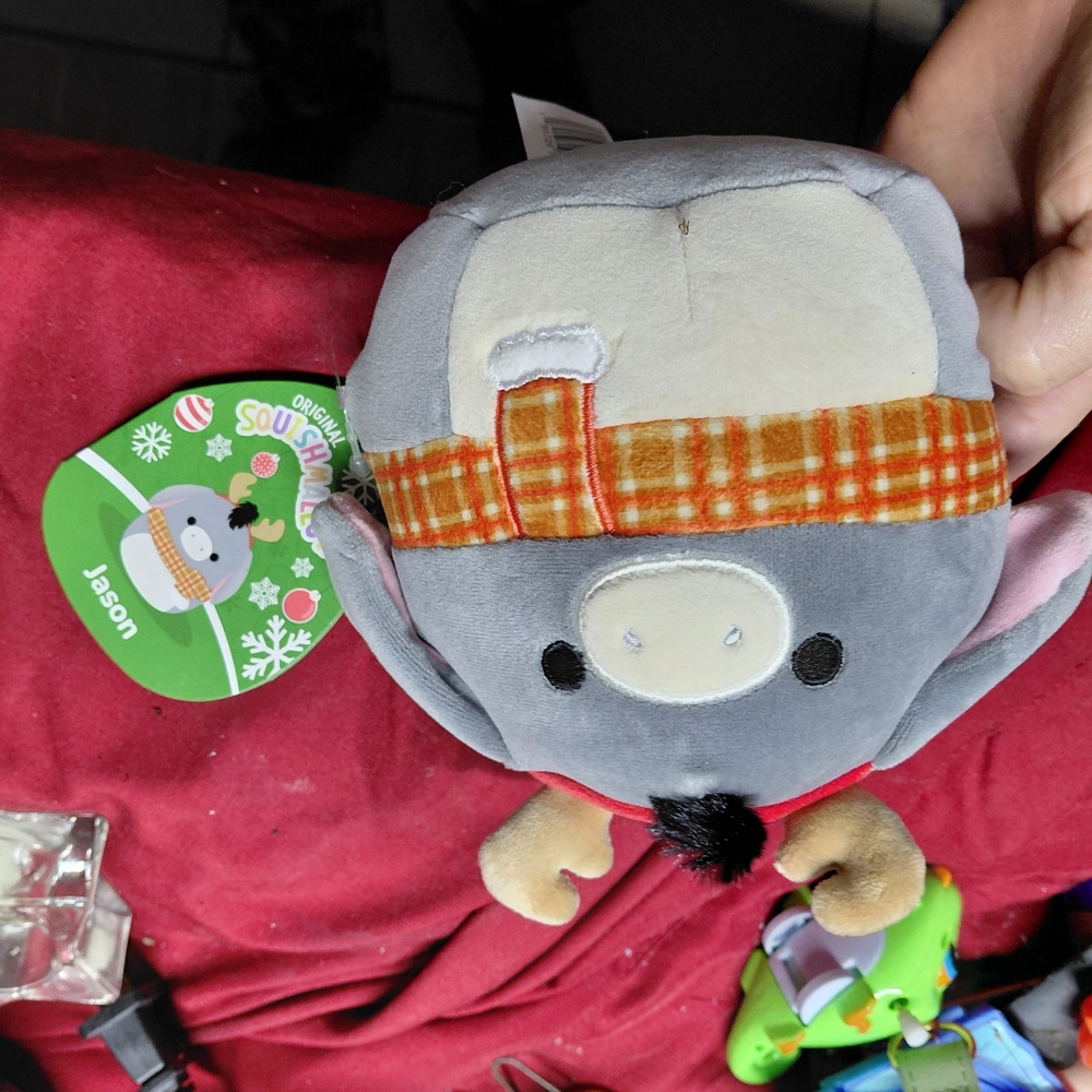 Squishmallows Jason the Donkey plush toy, part of a holiday collection featuring